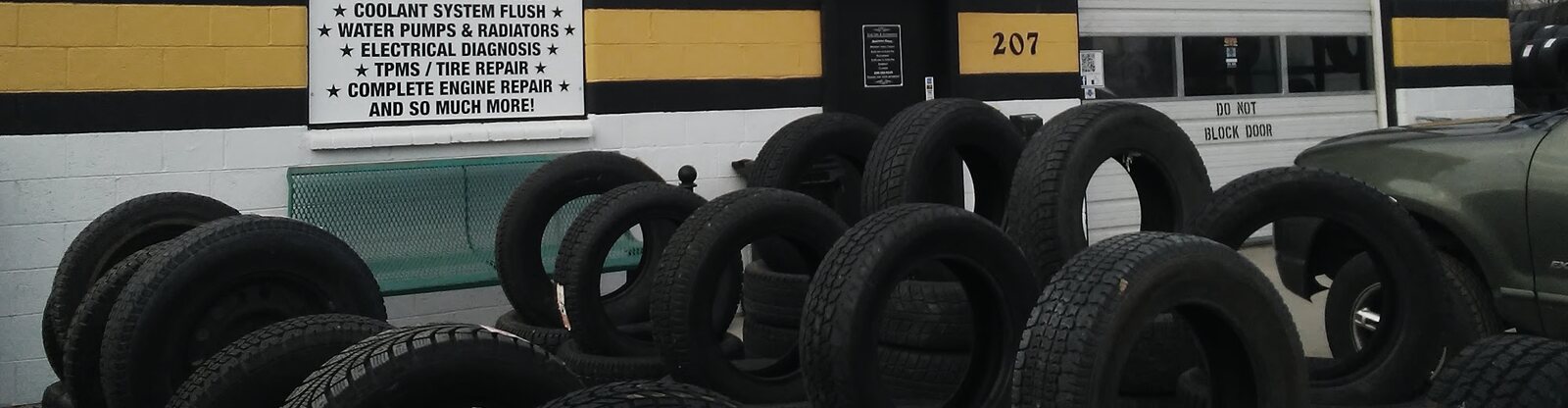 A rack of used tires in the lot at Star Tire and Auto